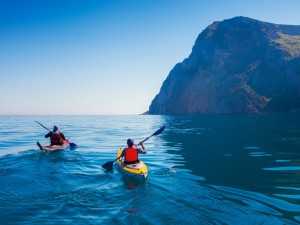 People Kayaking in the Ocean