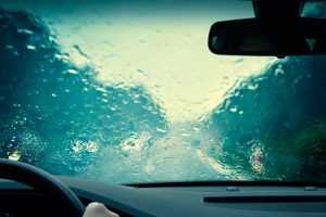 A windshield heavily obscured by rain