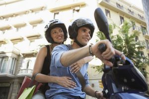 Man and woman wearing their helmets for safety ride