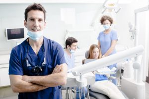 Dentists and patient in clinic