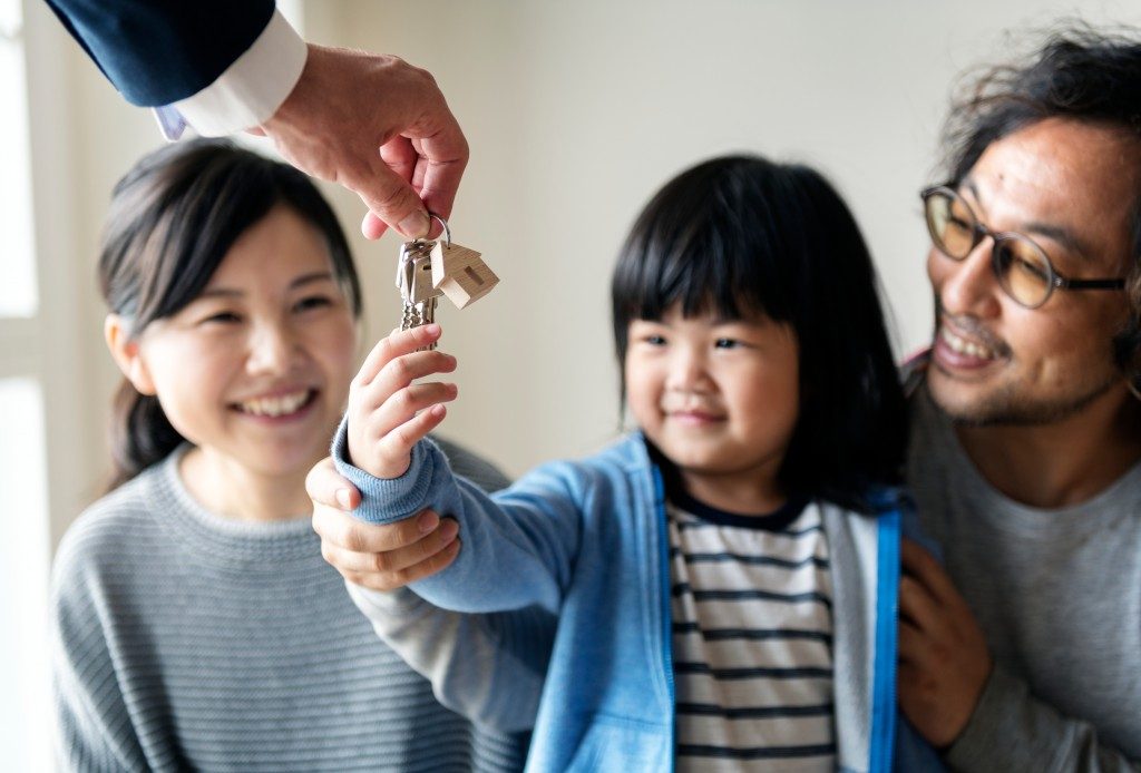 Child holding new house keys