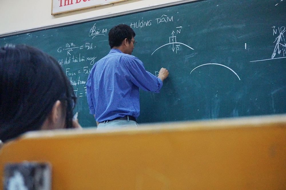 Teacher writing on the board